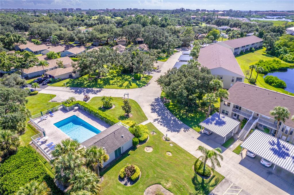 841 Waterside Drive, Unit 202 Venice, FL 34285 - Photo 36 of 43 an aerial view of swimming pool patio and mountain view