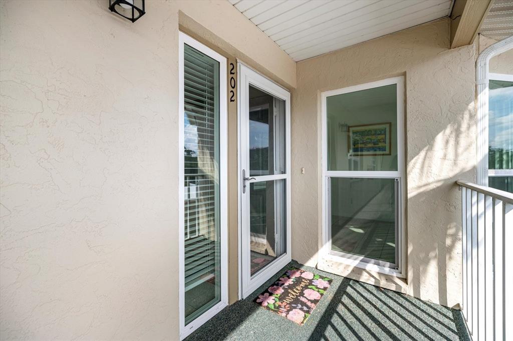 841 Waterside Drive, Unit 202 Venice, FL 34285 - Photo 4 of 43 a view of balcony and patio