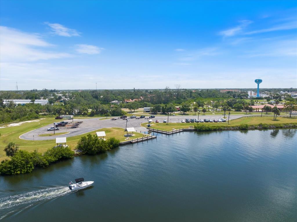 841 Waterside Drive, Unit 202 Venice, FL 34285 - Photo 42 of 43 a view of swimming pool with outdoor space and lake view