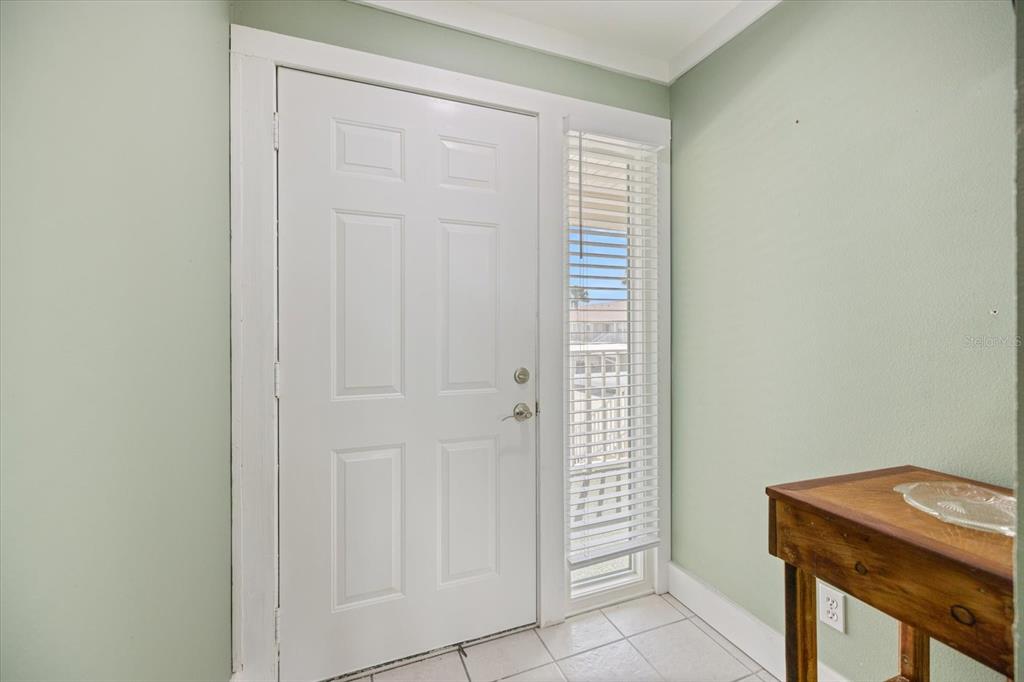 841 Waterside Drive, Unit 202 Venice, FL 34285 - Photo 5 of 43 an empty room with windows