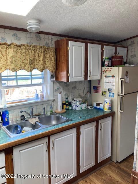 431 Gontarski Road Hallstead, PA 18822 - Photo 8 of 18 a kitchen with stainless steel appliances granite countertop a sink window and cabinets
