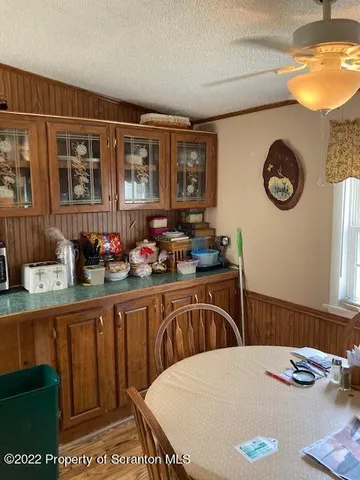 a kitchen with a table and chairs in it