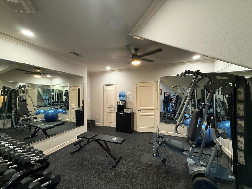 1919 Kings Pass Heath, TX 75032 - Photo 23 of 38 Exercise room featuring ceiling fan, recessed lighting, and crown molding
