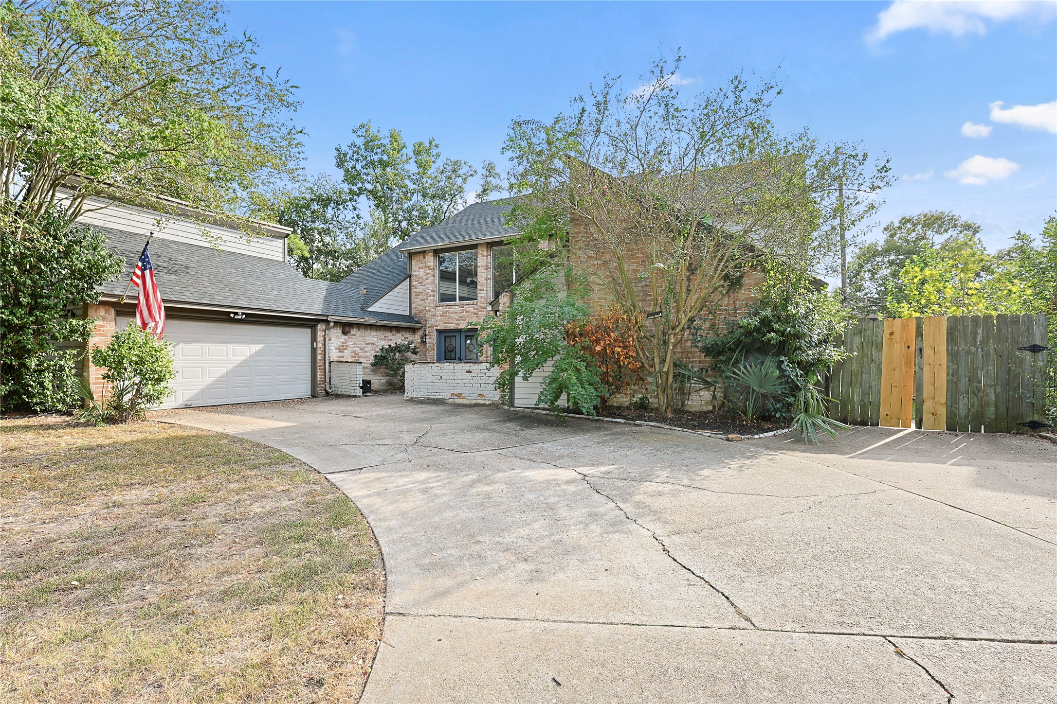 11727 Gardenglen Drive Cypress, TX 77429 - Photo 1 of 38 a front view of a house with a yard and garage