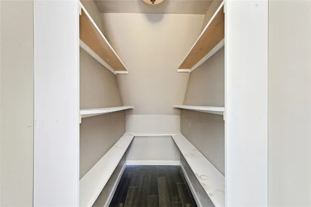 a kitchen with stainless steel appliances kitchen island granite countertop a refrigerator and a stove top oven