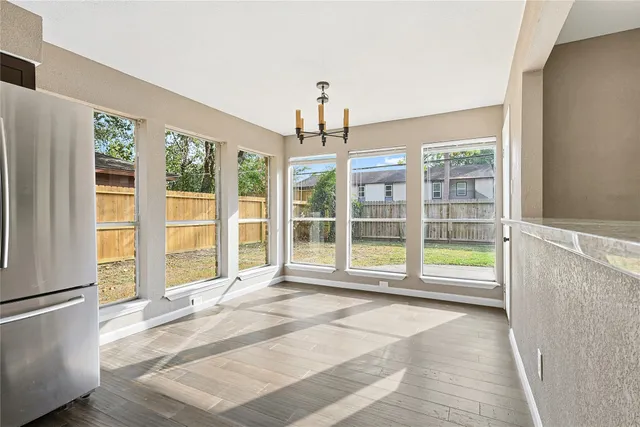 a view of a room with a ceiling fan