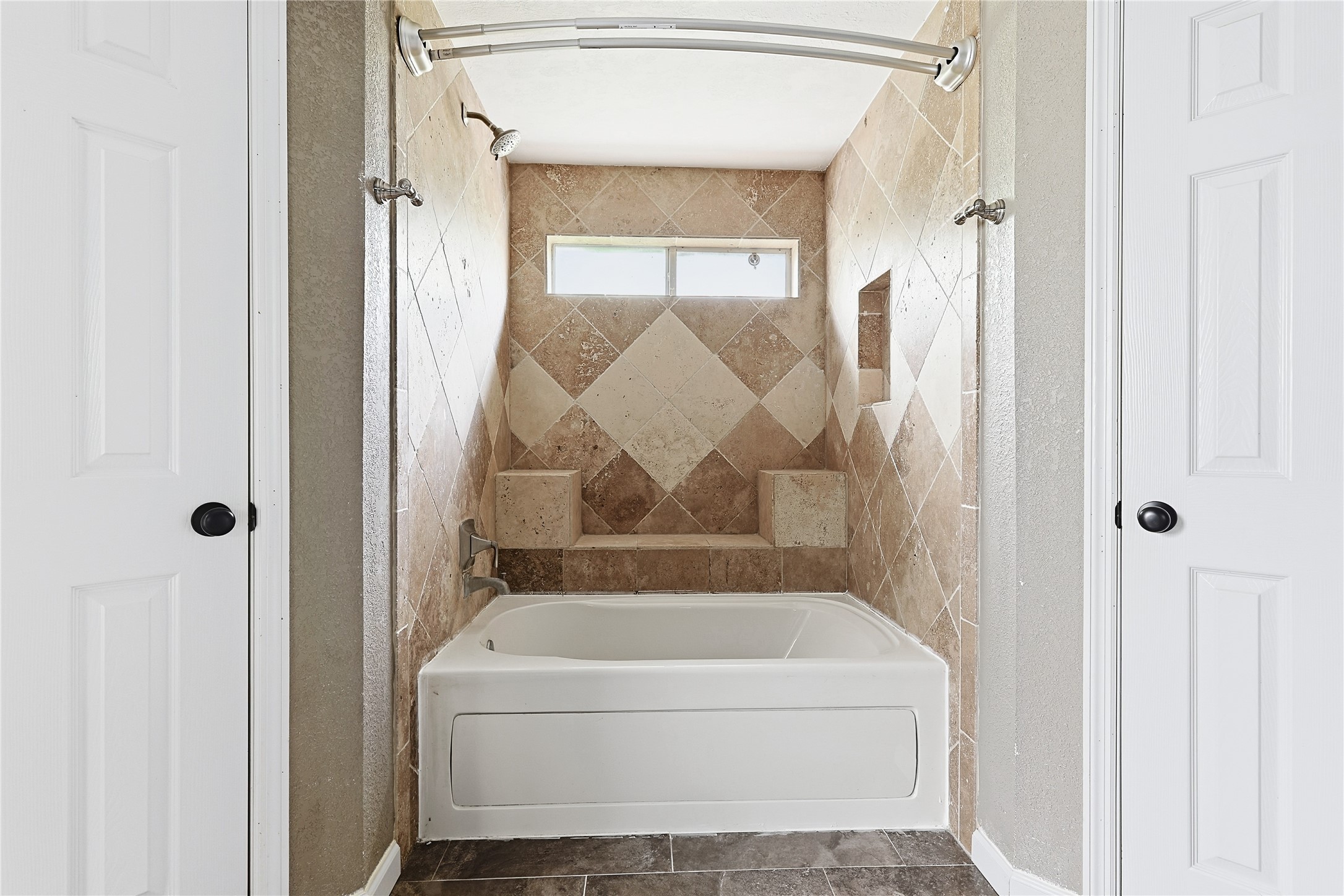 11727 Gardenglen Drive Cypress, TX 77429 - Photo 22 of 38 a bathroom with a tub and shower