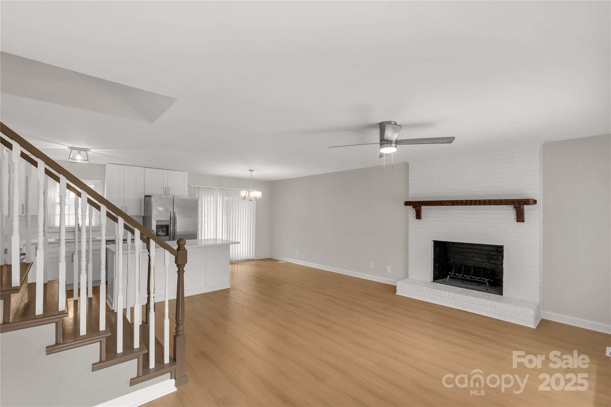 2220 Ross Cauthen Road Lancaster, SC 29720 - Photo 12 of 29 a view of an empty room with wooden floor fireplace and a window