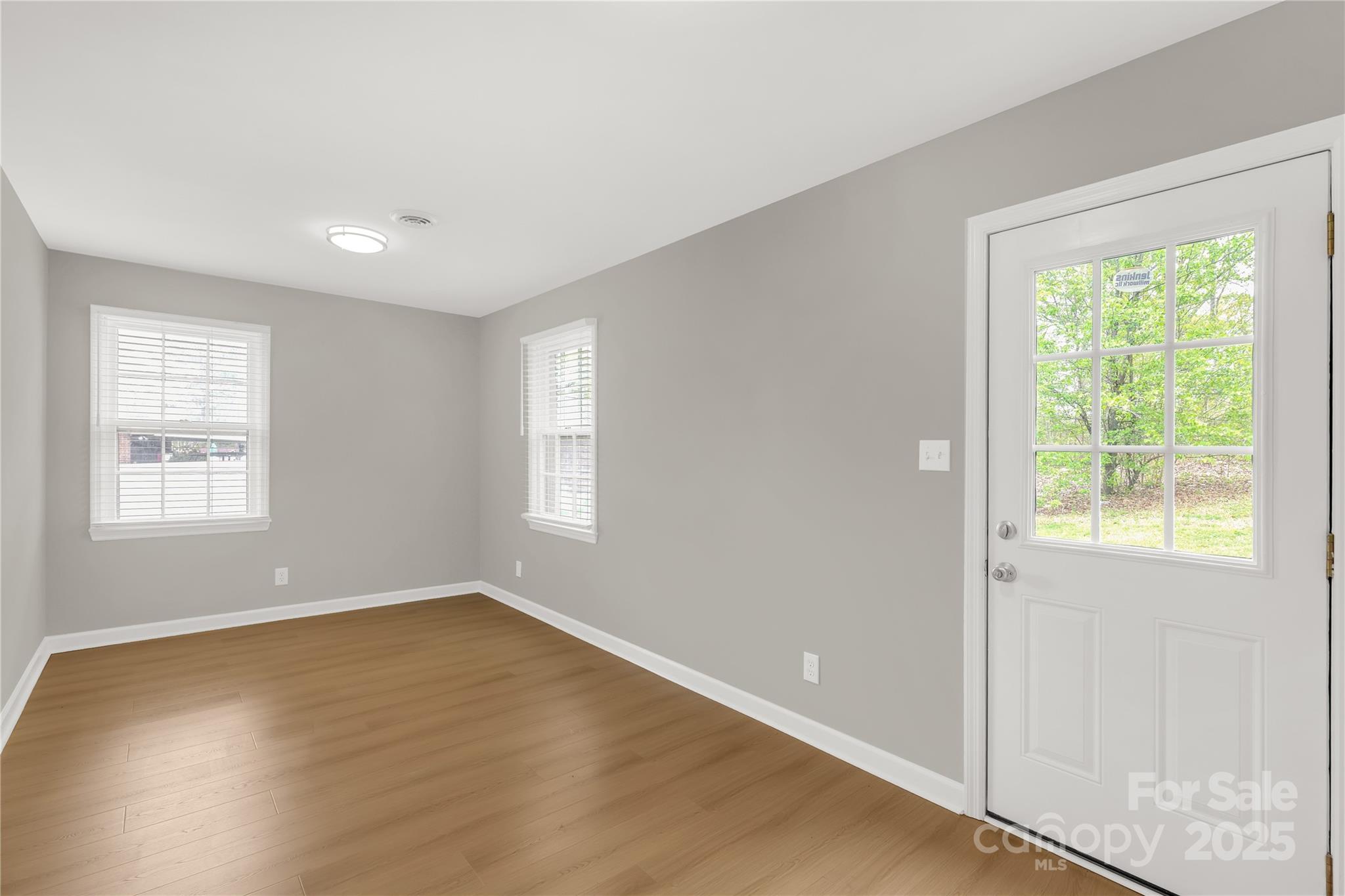 2220 Ross Cauthen Road Lancaster, SC 29720 - Photo 23 of 29 a view of an empty room with wooden floor and a window