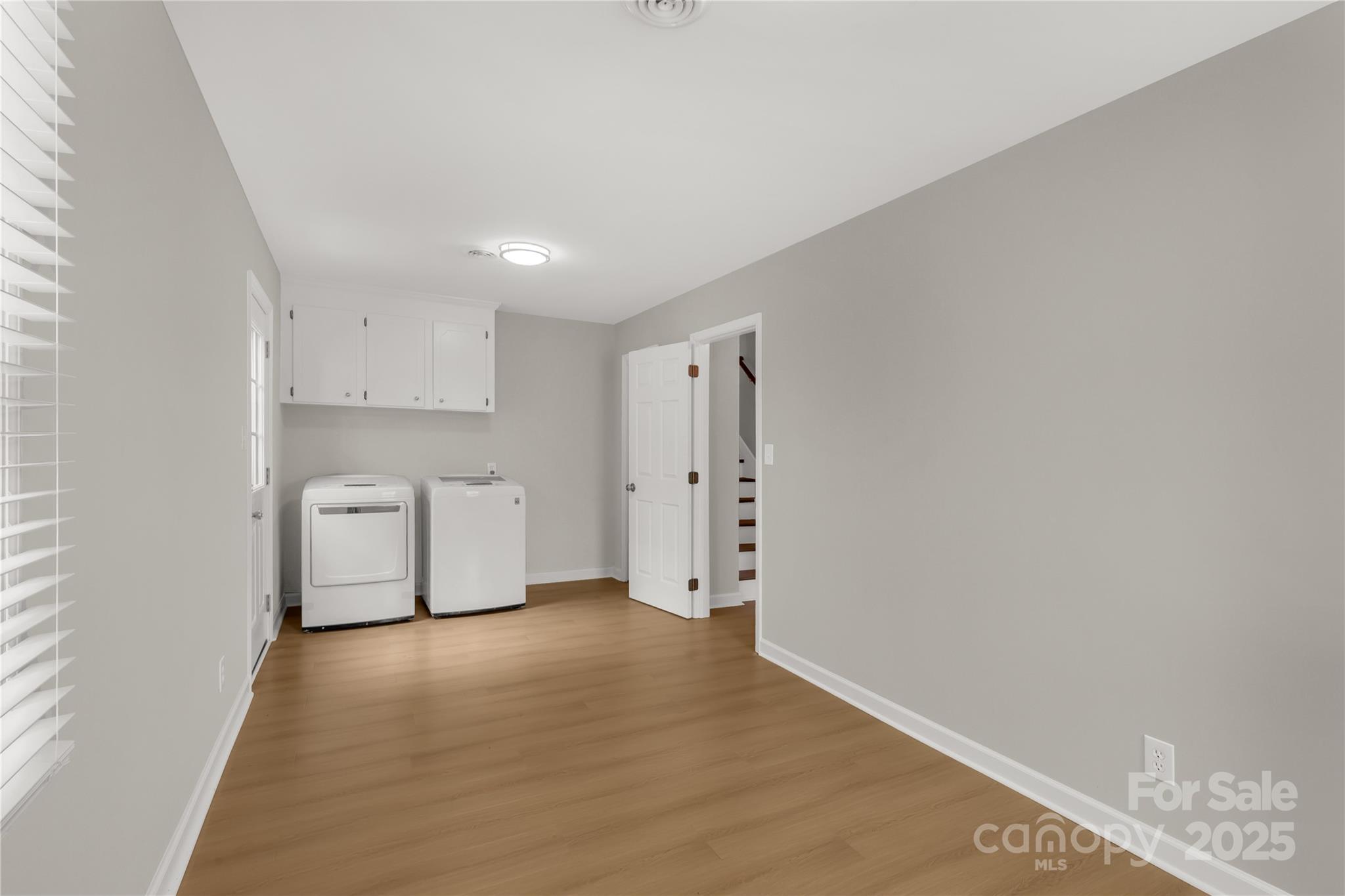 2220 Ross Cauthen Road Lancaster, SC 29720 - Photo 24 of 29 a view of a kitchen with white cabinets and wooden floor