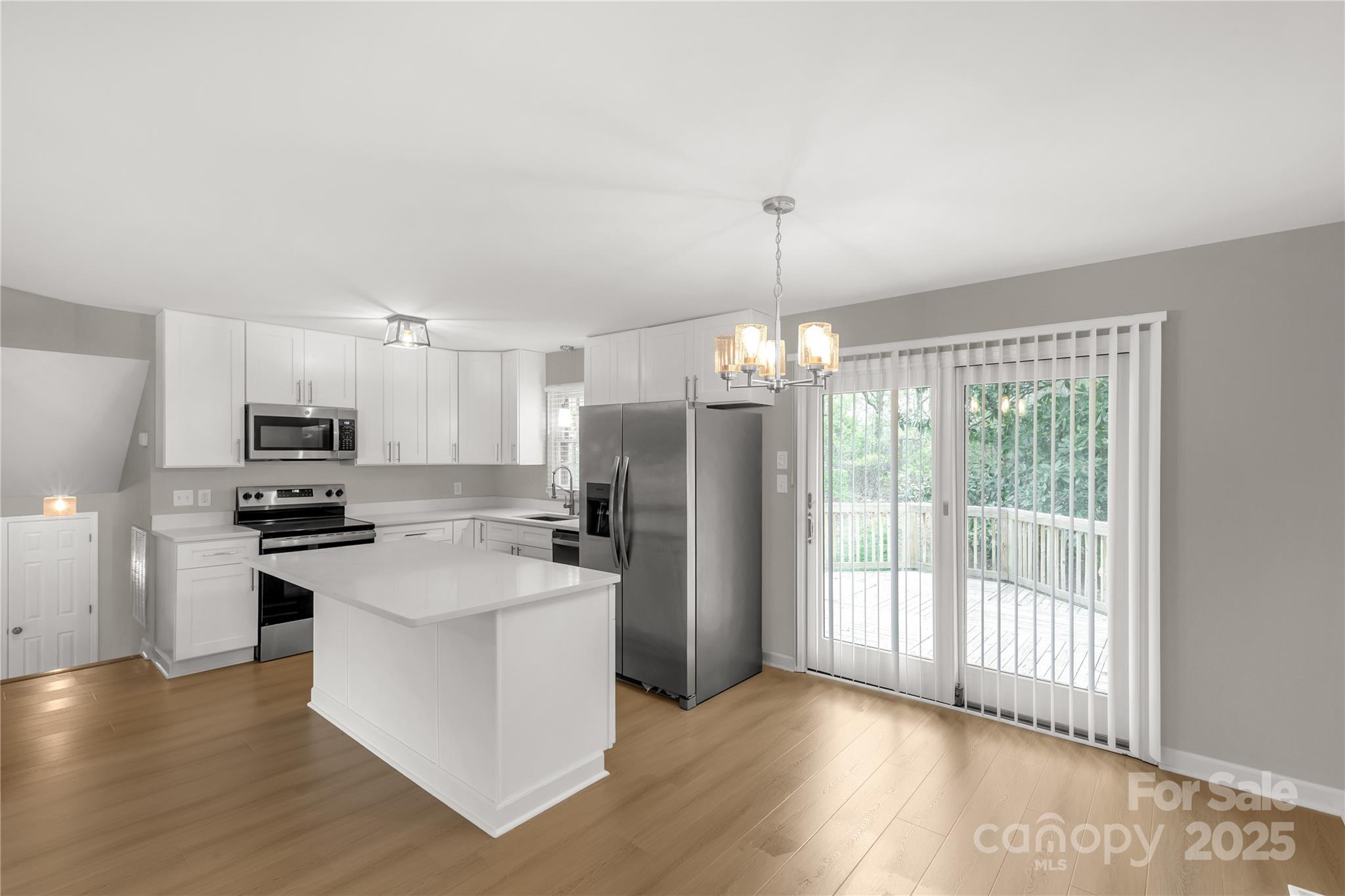 2220 Ross Cauthen Road Lancaster, SC 29720 - Photo 5 of 29 a kitchen with stainless steel appliances a refrigerator sink and stove