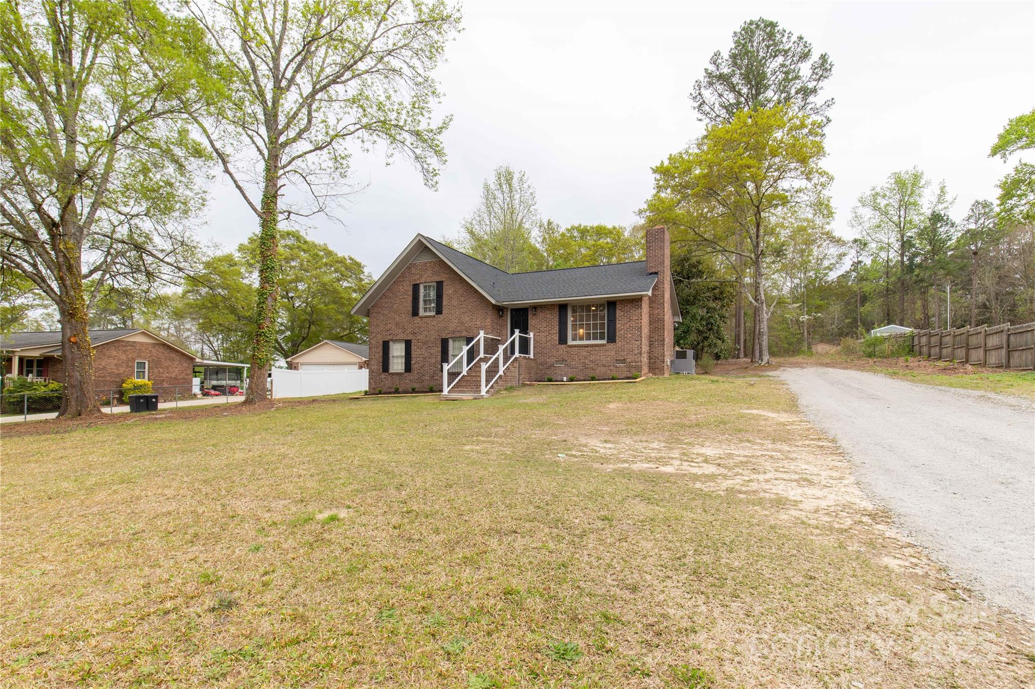 2220 Ross Cauthen Road Lancaster, SC 29720 - Photo 7 of 29 a front view of a house with a yard and trees