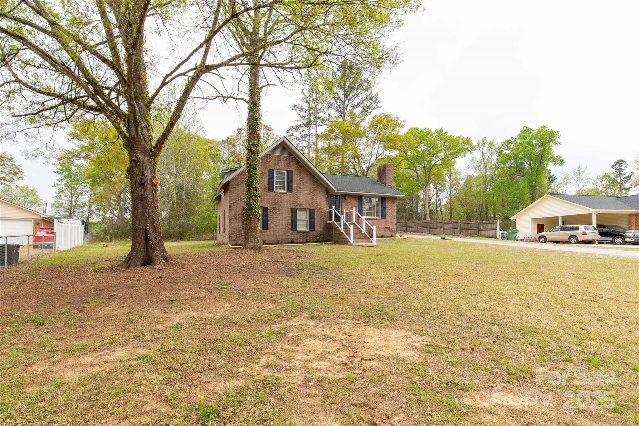 2220 Ross Cauthen Road Lancaster, SC 29720 - Photo 8 of 29 a front view of a house with a yard and large trees