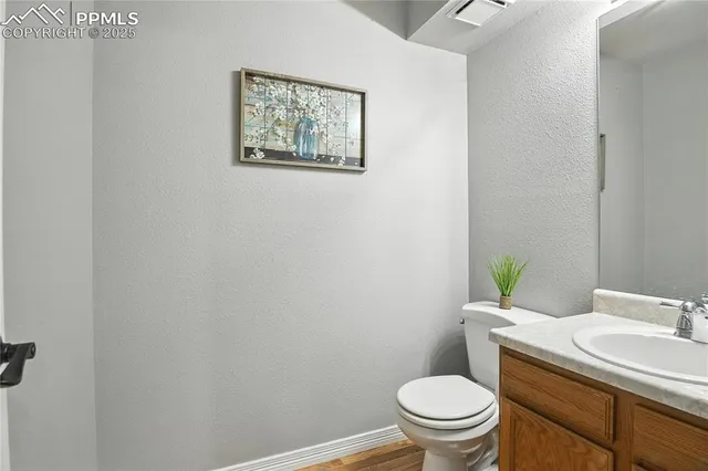 a white toilet sitting next to a bathroom sink