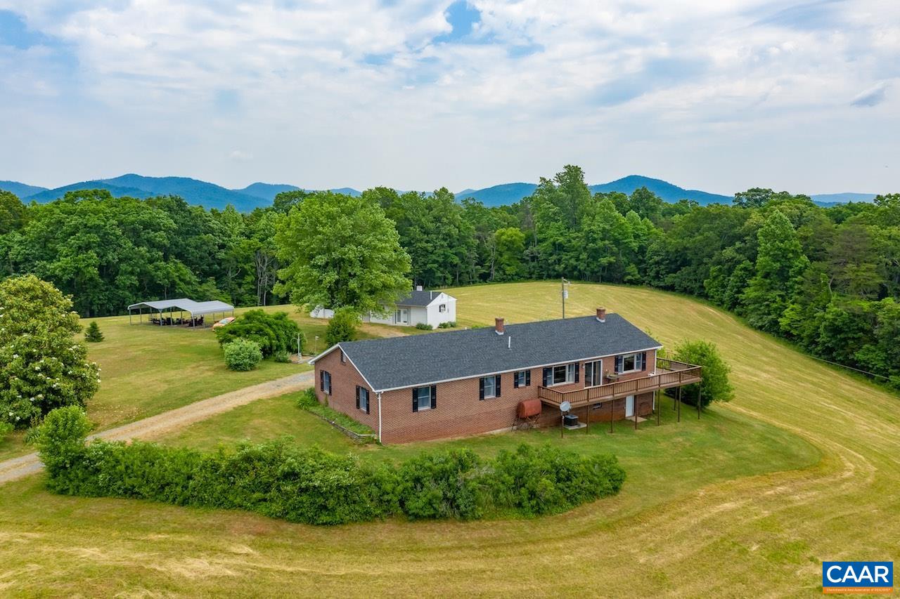 132 Rocky Road Lovingston, VA 22949 - Photo 3 of 48 an aerial view of a house with swimming pool and green space