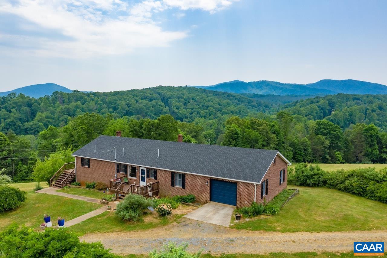 132 Rocky Road Lovingston, VA 22949 - Photo 4 of 48 an aerial view of house with yard and mountain in the background