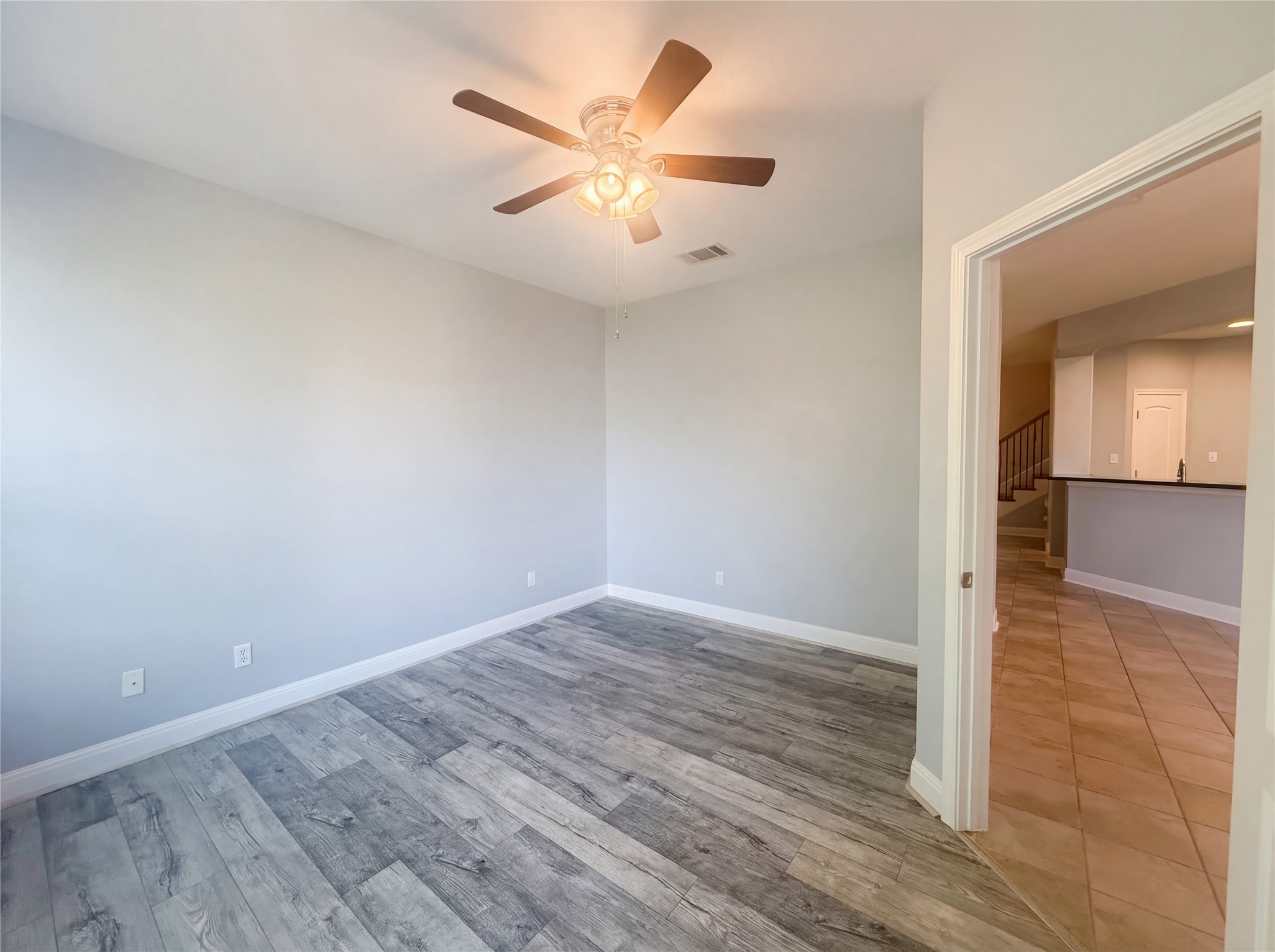 104 Perpetuation Drive Austin, TX 78734 - Photo 11 of 29 Spare room with ceiling fan and light wood-style floors