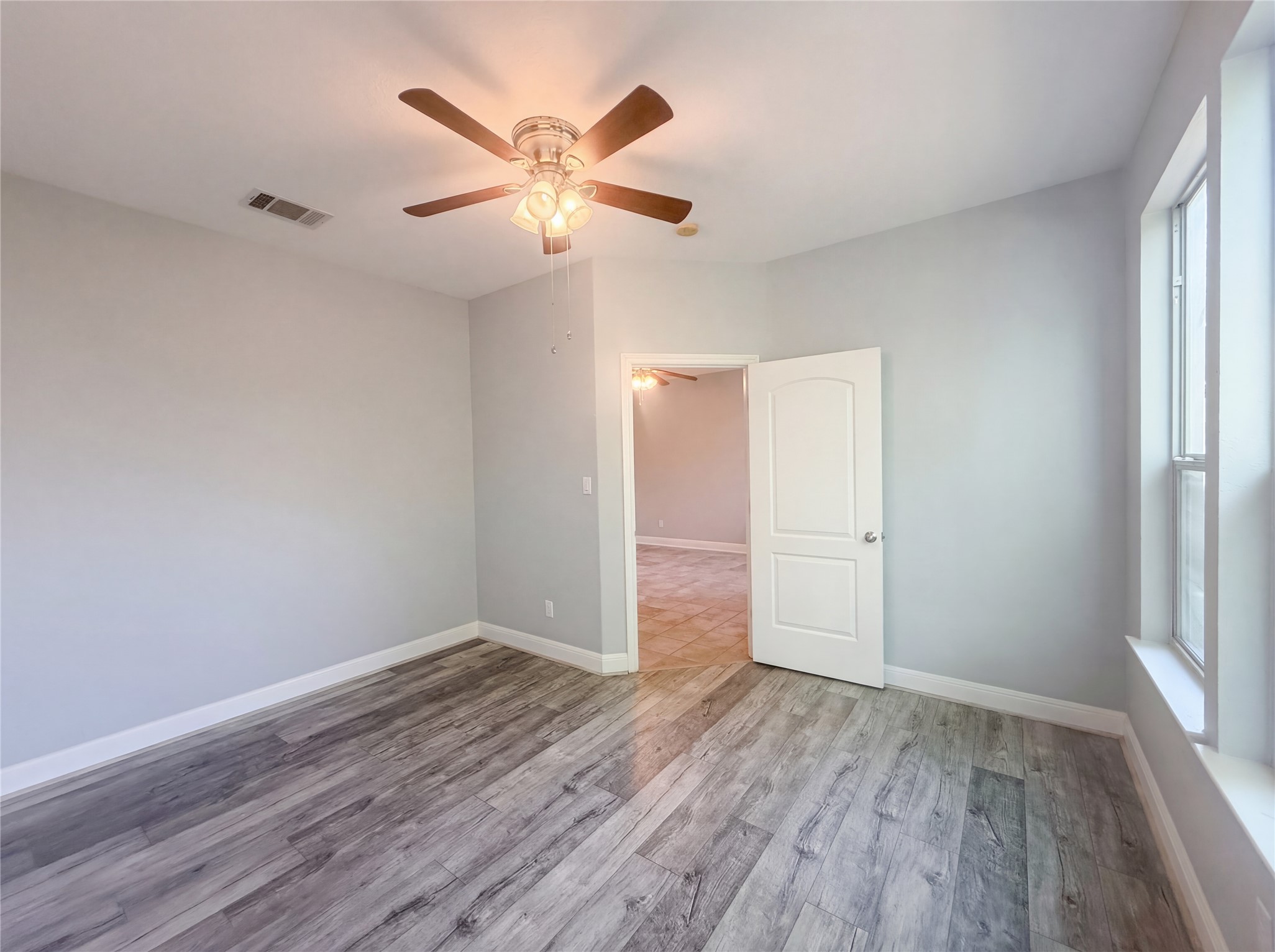104 Perpetuation Drive Austin, TX 78734 - Photo 12 of 29 Spare room featuring light wood-style floors and ceiling fan