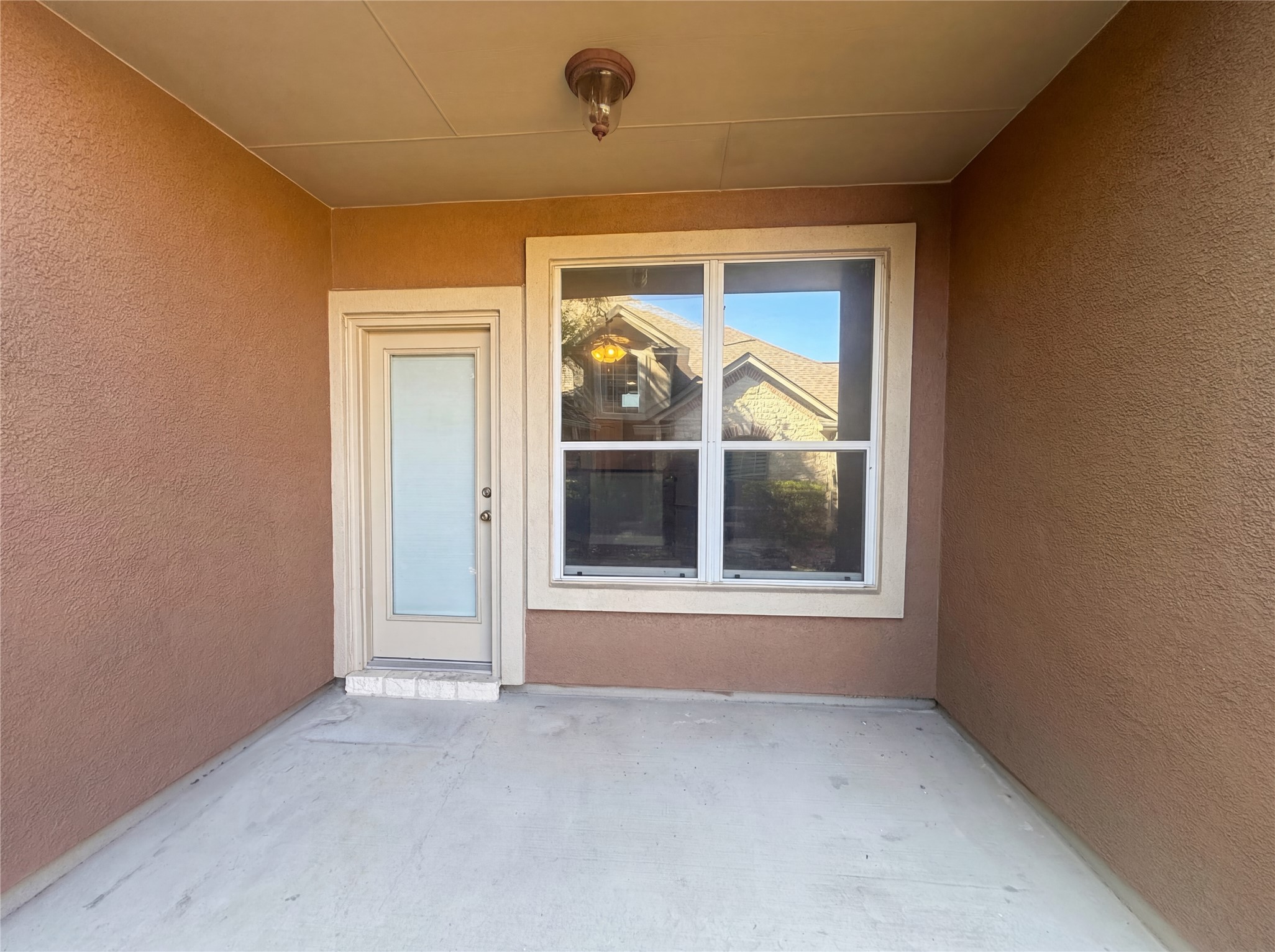 104 Perpetuation Drive Austin, TX 78734 - Photo 13 of 29 Entrance to property featuring a patio and stucco siding