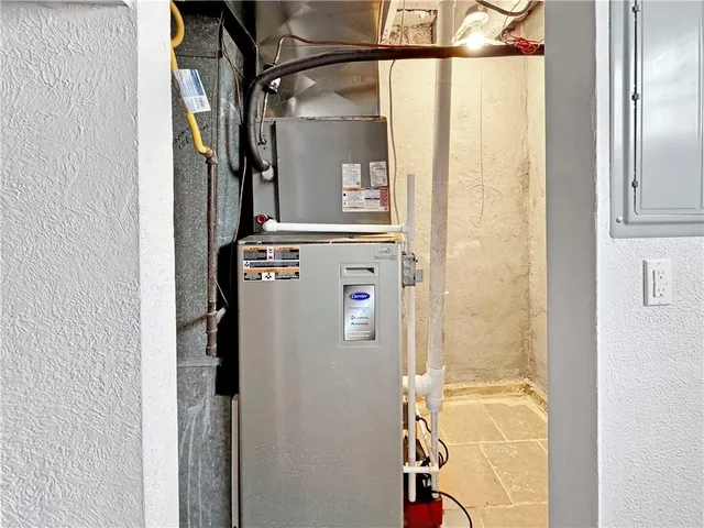 a utility room with a shower and cabinets