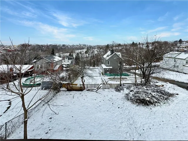 a view of a road with a building in the background
