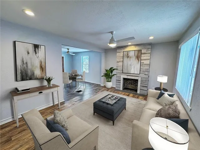 a living room with furniture and a fireplace