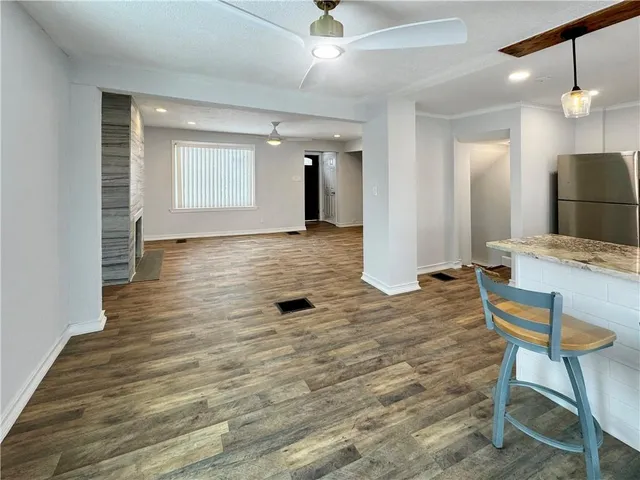 a view of a livingroom with furniture nad wooden floor