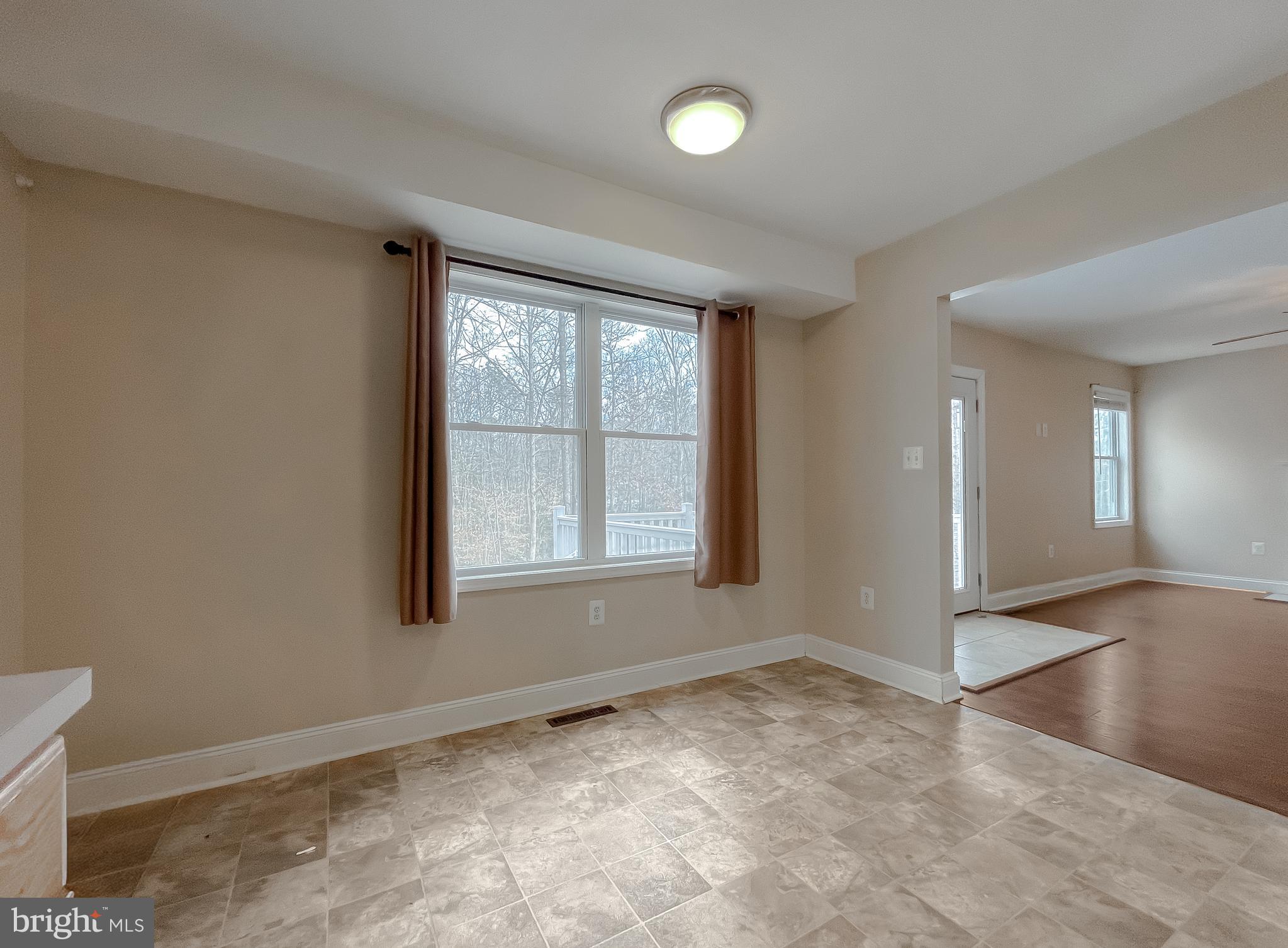 12968 Sailboat Lane Lusby, MD 20657 - Photo 16 of 57 an empty room with windows and closet