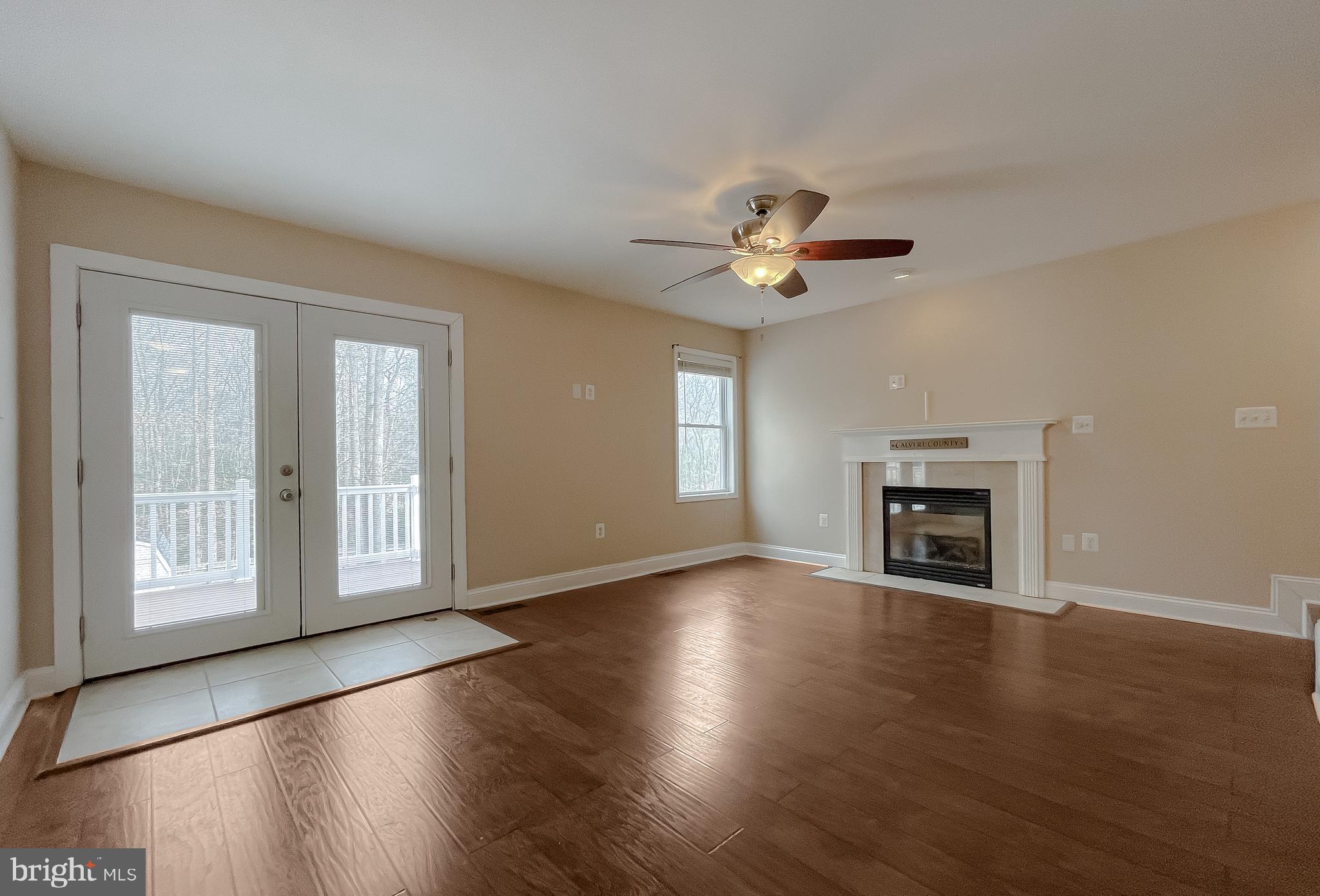 12968 Sailboat Lane Lusby, MD 20657 - Photo 25 of 57 a view of an empty room with window and wooden floor