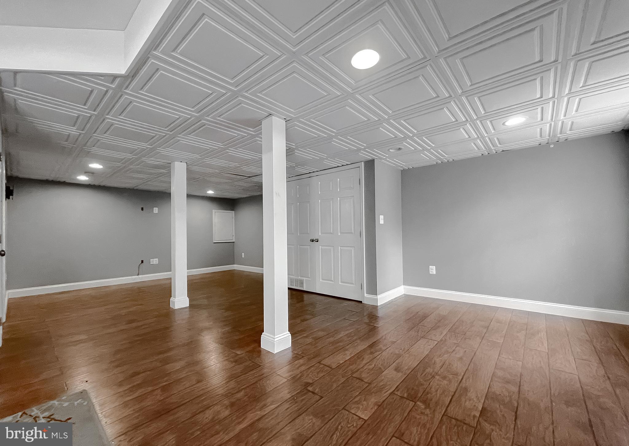 12968 Sailboat Lane Lusby, MD 20657 - Photo 49 of 57 a view of an empty room with wooden floor