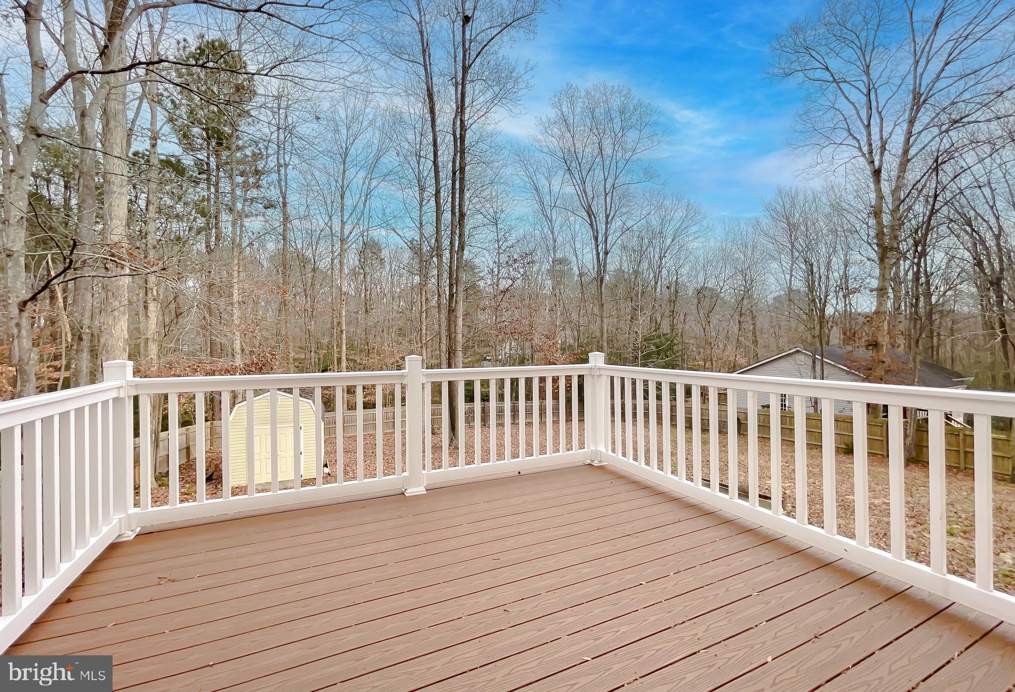 12968 Sailboat Lane Lusby, MD 20657 - Photo 53 of 57 a balcony with wooden floor and fence