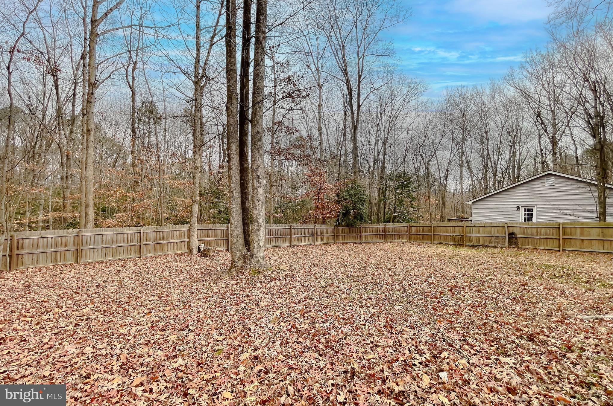 12968 Sailboat Lane Lusby, MD 20657 - Photo 54 of 57 a view of a house with a yard