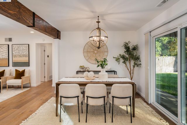 a dining room with furniture and window