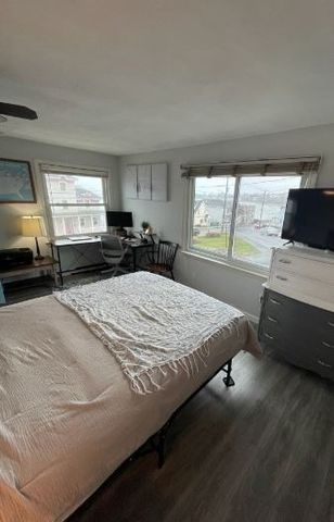 a workstation with a computer on a desk and chair
