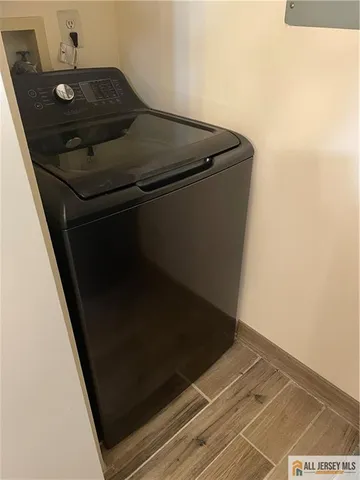 a view of backyard with wooden stairs and a potted plant