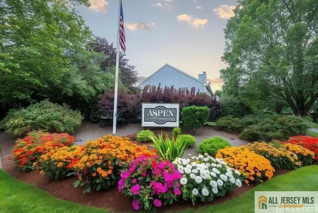 a view of a chair and tables in the back yard of the house