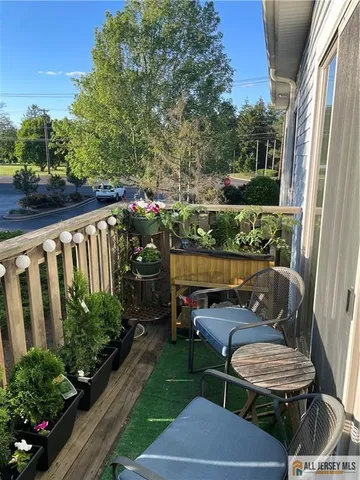 a view of a big yard with lots of green space