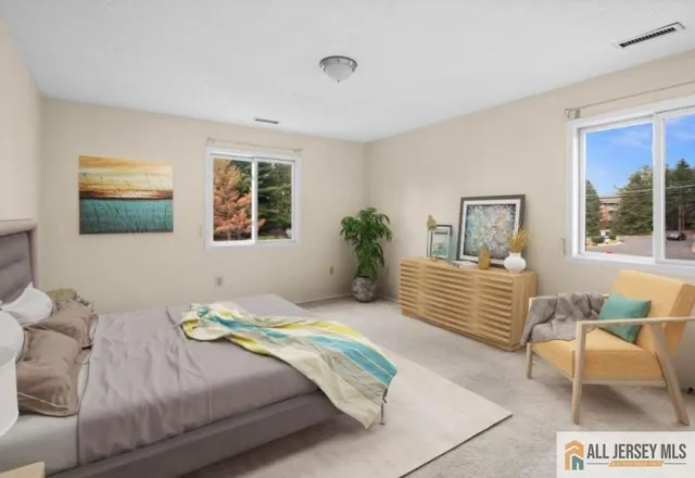 a bedroom with a bed and a couch