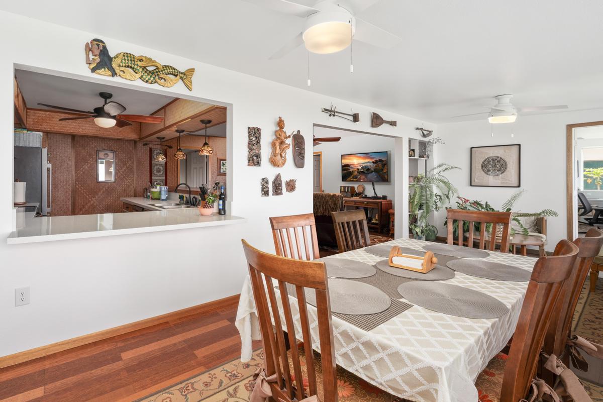 85-4563 Hawaii Belt Road Captain Cook, HI 96704 - Photo 11 of 30 a view of a dining room with furniture