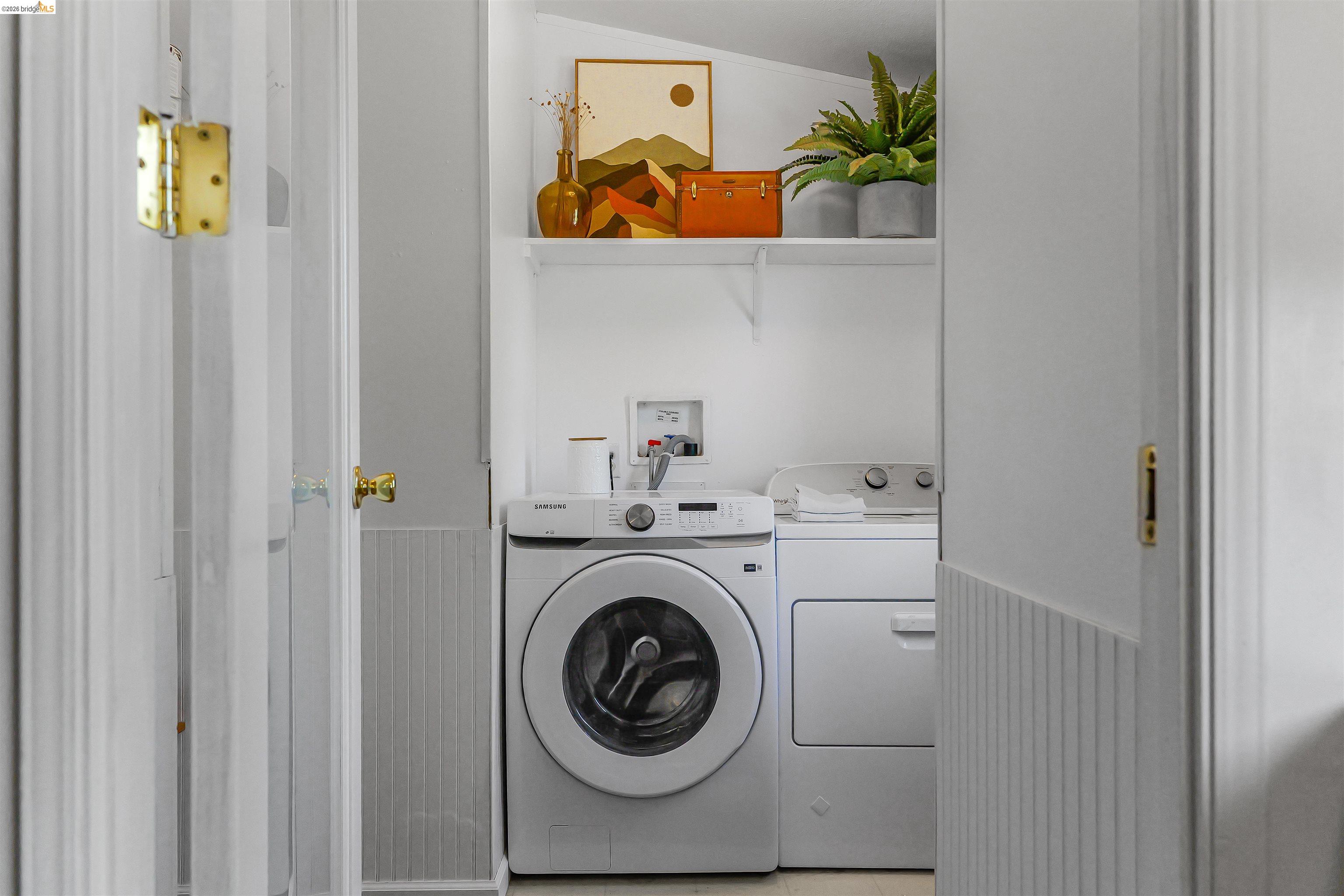 4419 Little John Road Copperopolis, CA 95228 - Photo 20 of 43 Dedicated laundry area featuring a front-loading washing machine and matching dryer