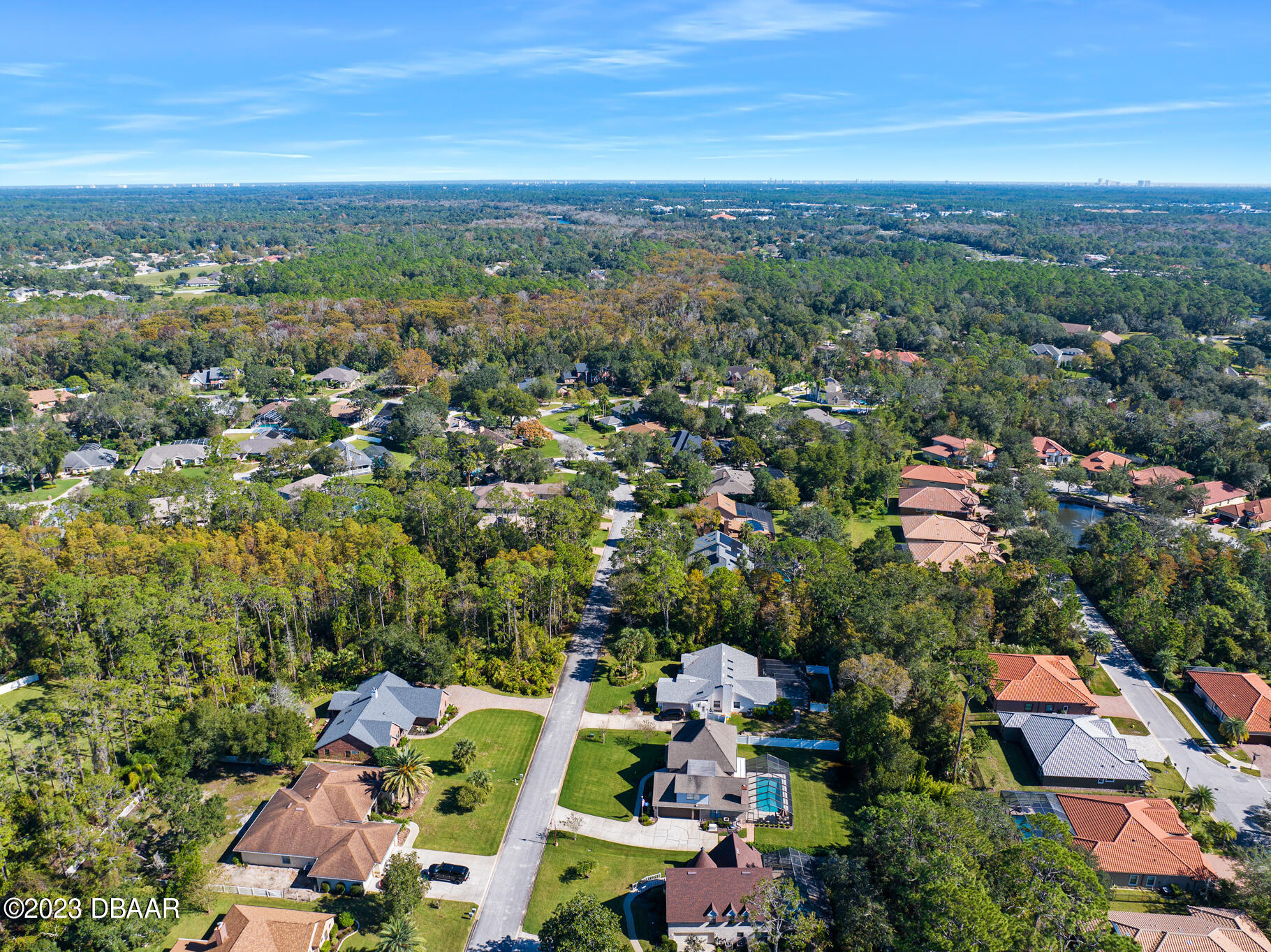 48 Winding Creek Way Ormond Beach, FL 32174 - Photo 11 of 11 an aerial view of a city with lots of residential buildings ocean and mountain view in back