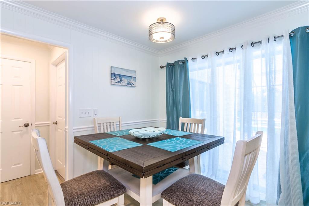 28 Constitution Drive Naples, FL 34112 - Photo 11 of 30 a room with a table and a window