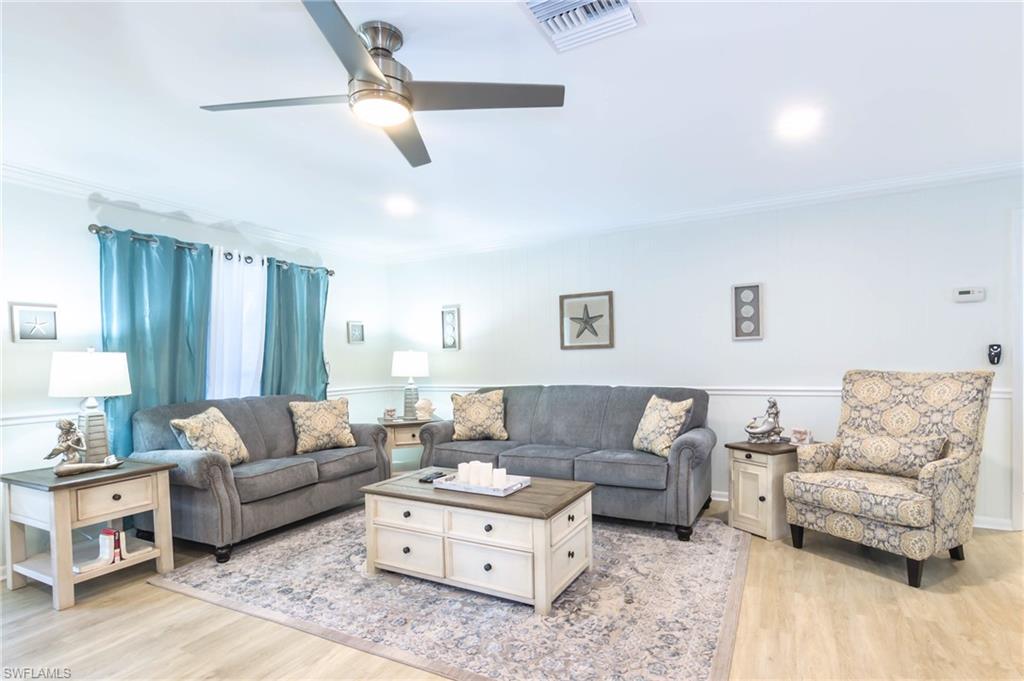 28 Constitution Drive Naples, FL 34112 - Photo 14 of 30 a living room with furniture and a couch