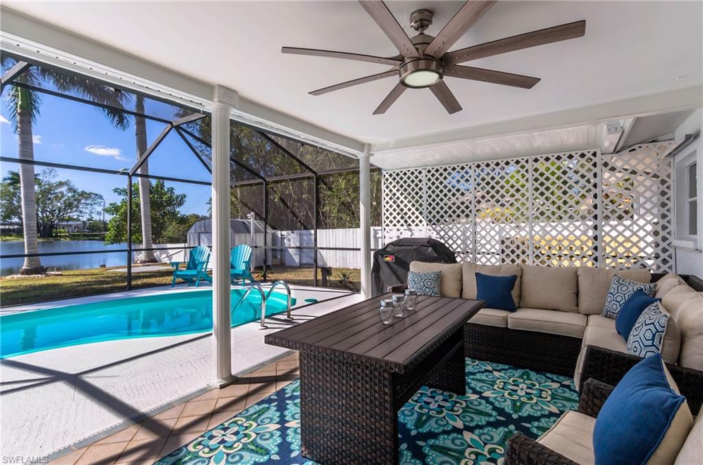 28 Constitution Drive Naples, FL 34112 - Photo 18 of 30 a outdoor space with patio the couches and a dining table with garden view