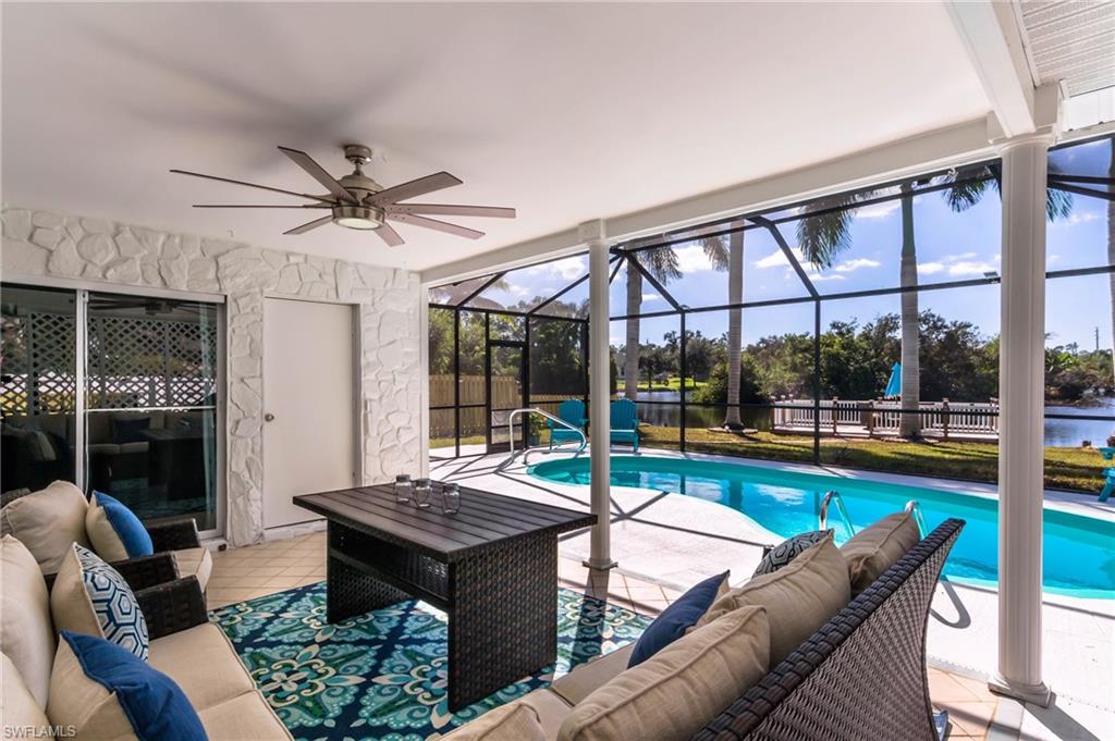28 Constitution Drive Naples, FL 34112 - Photo 19 of 30 a living room with furniture and a large window