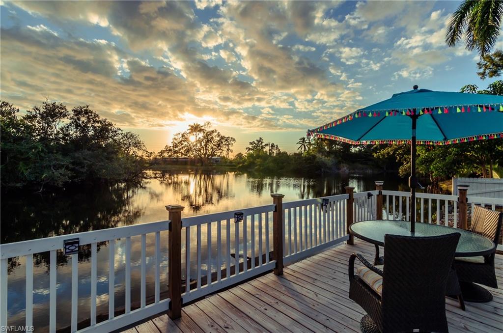28 Constitution Drive Naples, FL 34112 - Photo 21 of 30 a view of deck with furniture and trees