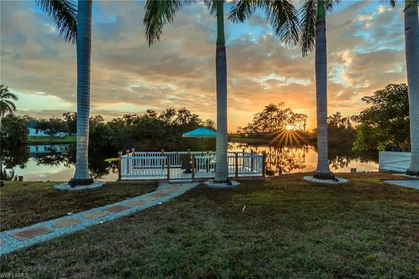 a view of a lake with sitting area