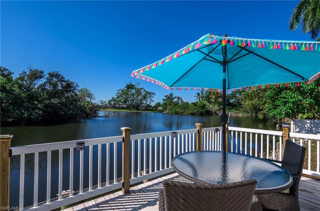 28 Constitution Drive Naples, FL 34112 - Photo 7 of 30 a view of balcony with furniture and umbrella