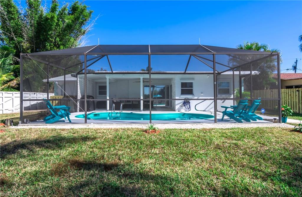 28 Constitution Drive Naples, FL 34112 - Photo 9 of 30 a view of a house with a yard and sitting area