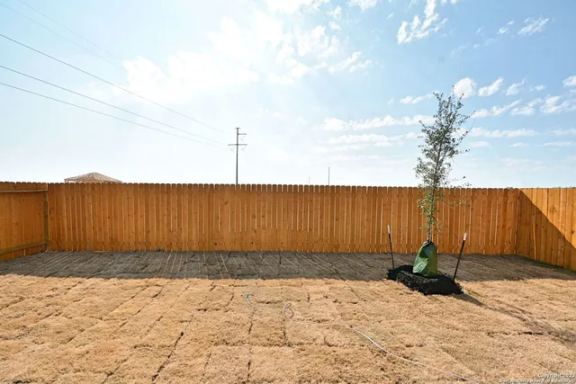a view of a backyard of a house